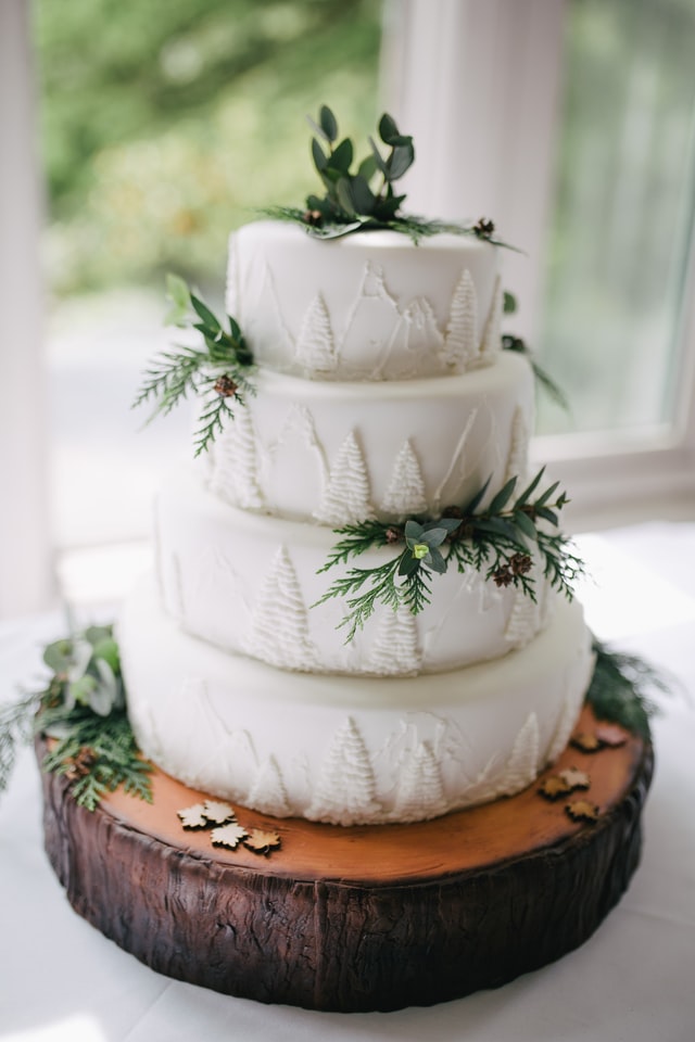 White Wedding cake with forest leaves